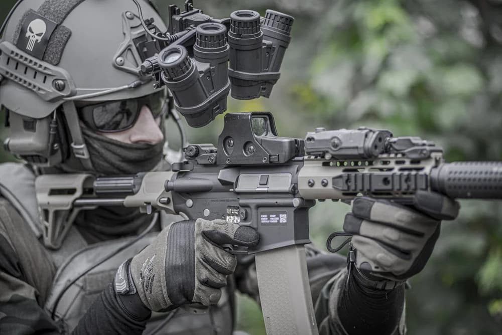 Service member sighting a rifle