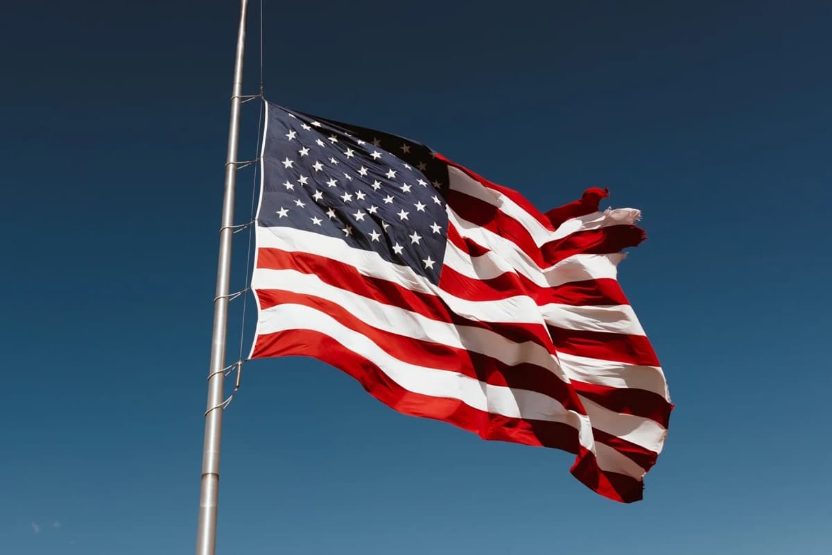 United States flag flying against a clear sky