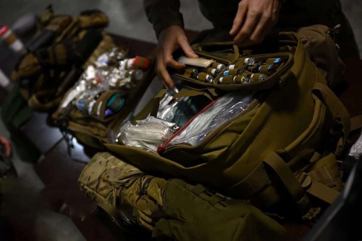 Assembled field medical kits packed into tactical bags